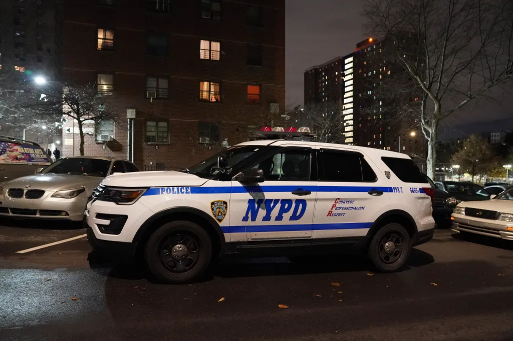 NYPD vehicle at the Gouverneur Morris Houses where a person was fatally shot.