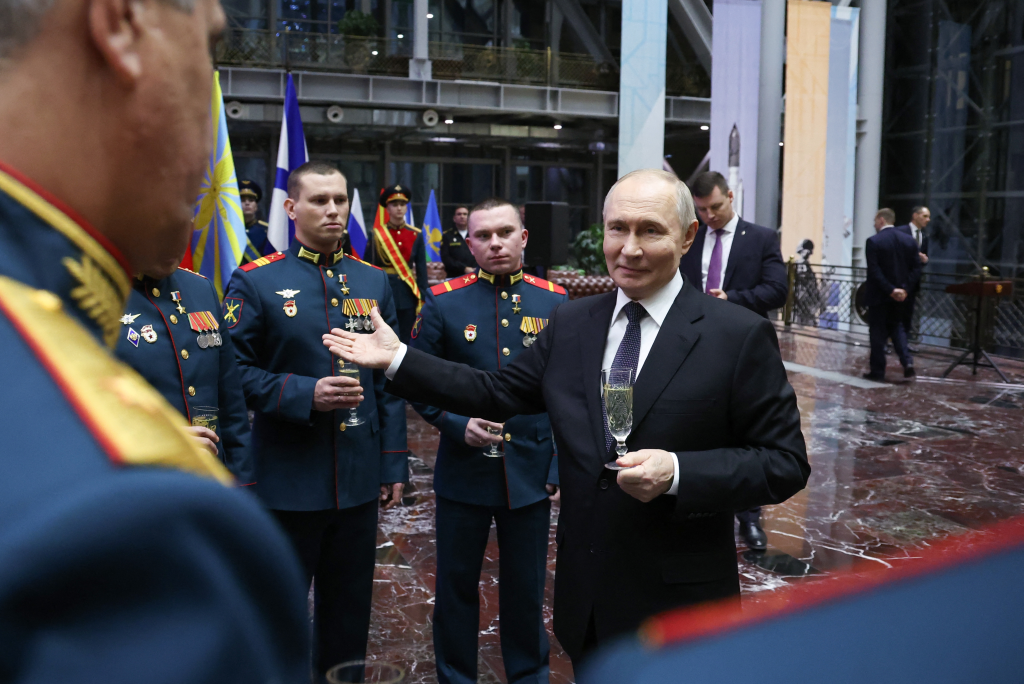 Russia's President Vladimir Putin meets with recipients of Gold Star medal of Hero of Russia after an expanded meeting of the Russian Defence Ministry Board at the National Defence Control Centre in Moscow on December 17, 2025.
