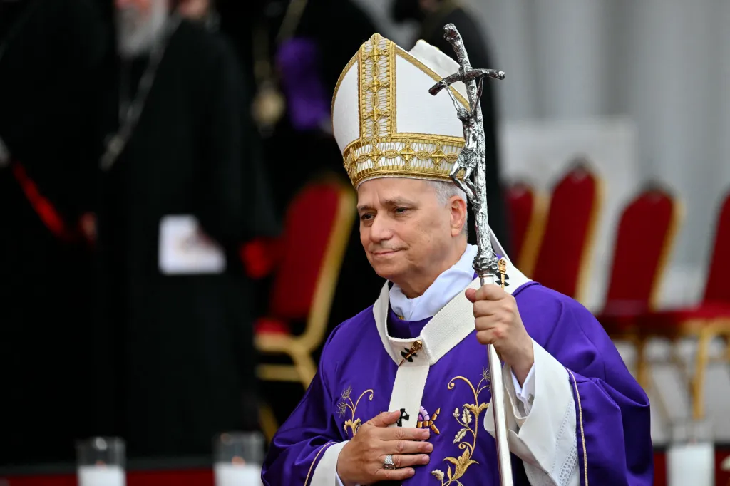 Pope Leo XIV in purple vestments, white miter, and holding a cross staff.