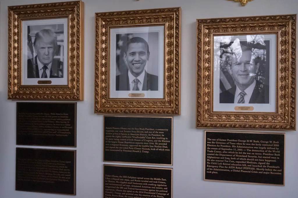 Portraits of Presidents Donald Trump, Barack Obama, and George W. Bush on the Presidential Walk of Fame.