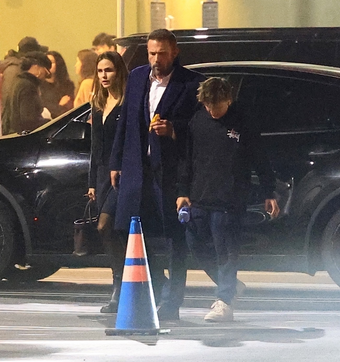 Ben Affleck, Jennifer Garner, and Samuel Affleck exiting a school play.