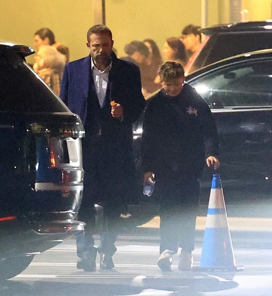 Ben Affleck, Jennifer Garner, and Samuel Affleck exiting a school play.