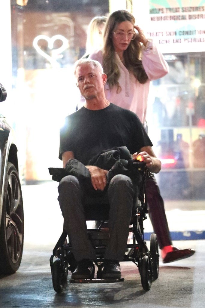 Eric Dane in a wheelchair with Rebecca Gayheart pushing him at Sushi Park.
