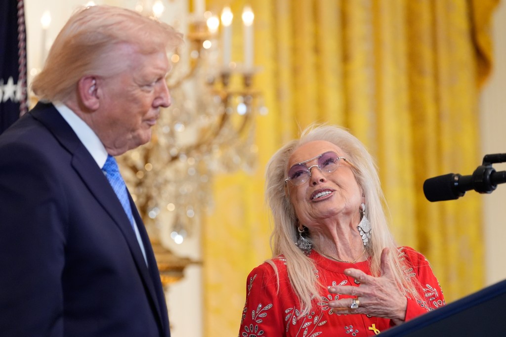 Donald Trump listening to Miriam Adelson speak at a Hanukkah reception.
