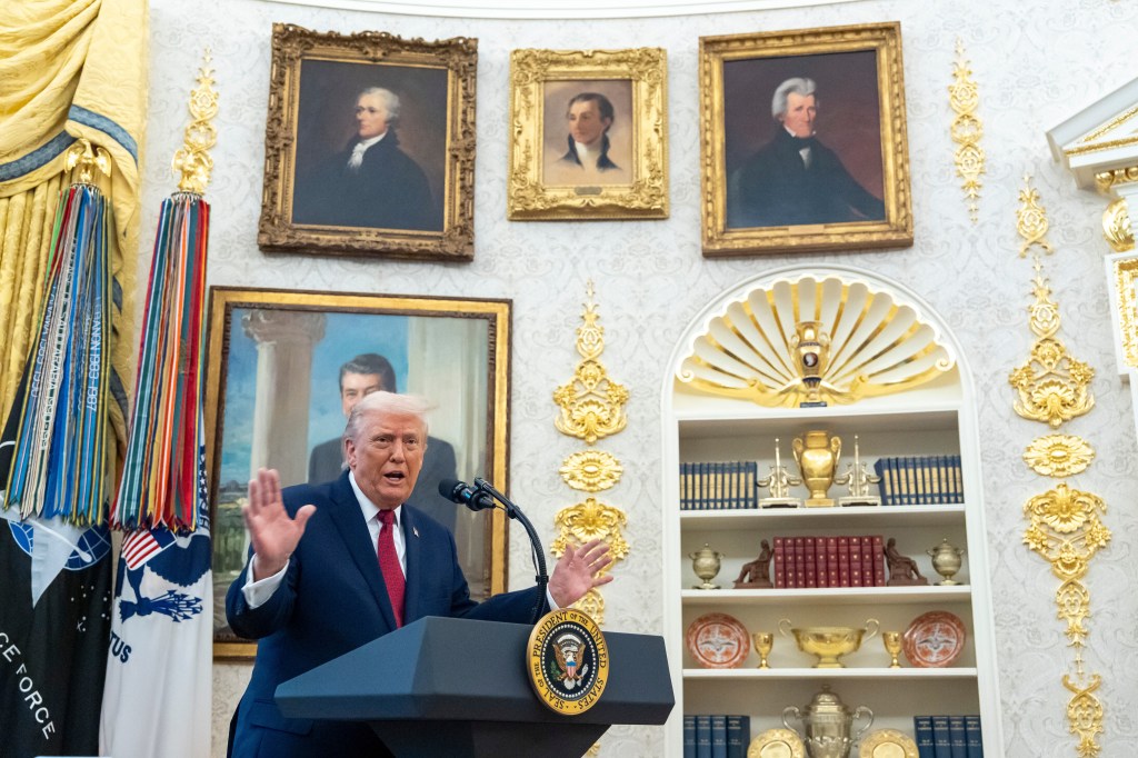 Donald Trump speaking at a podium with the Seal of the President of the United States in the Oval Office.