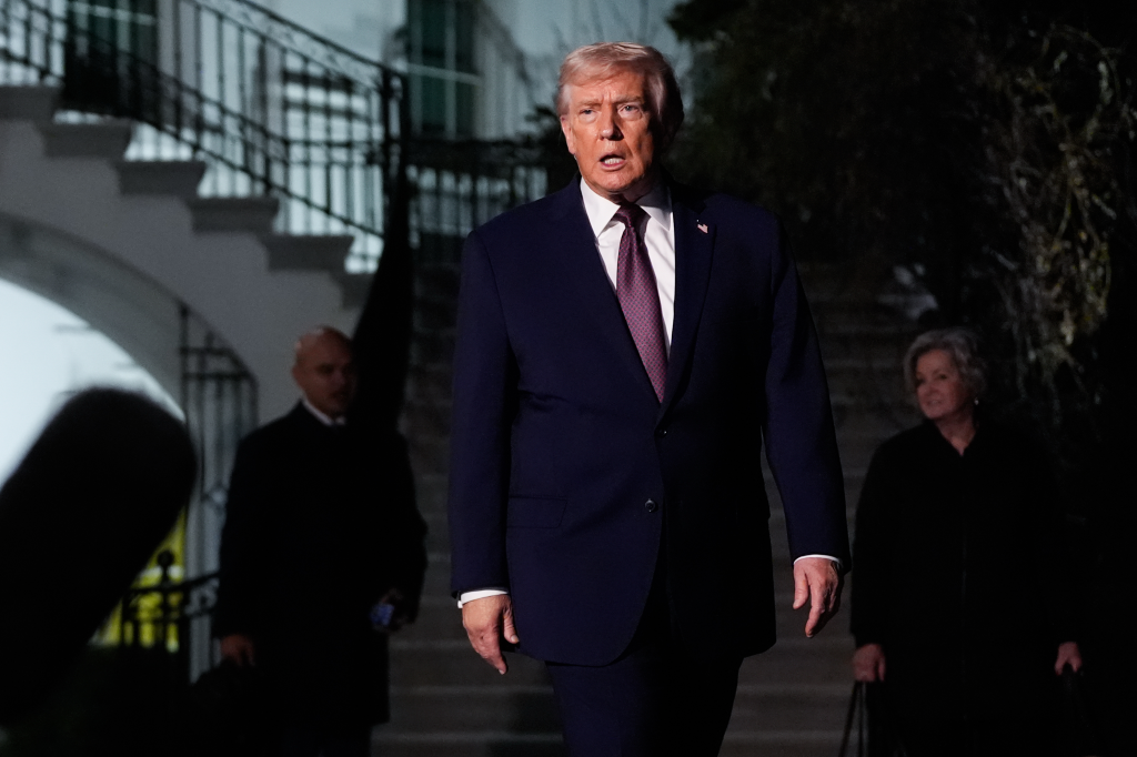 President Donald Trump walking with chief of staff Susie Wiles.