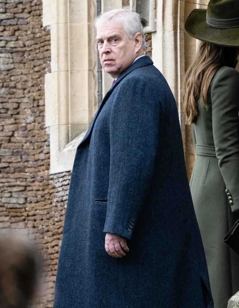Prince Andrew looking over his shoulder at the camera while wearing a blue coat at Sandringham Church.