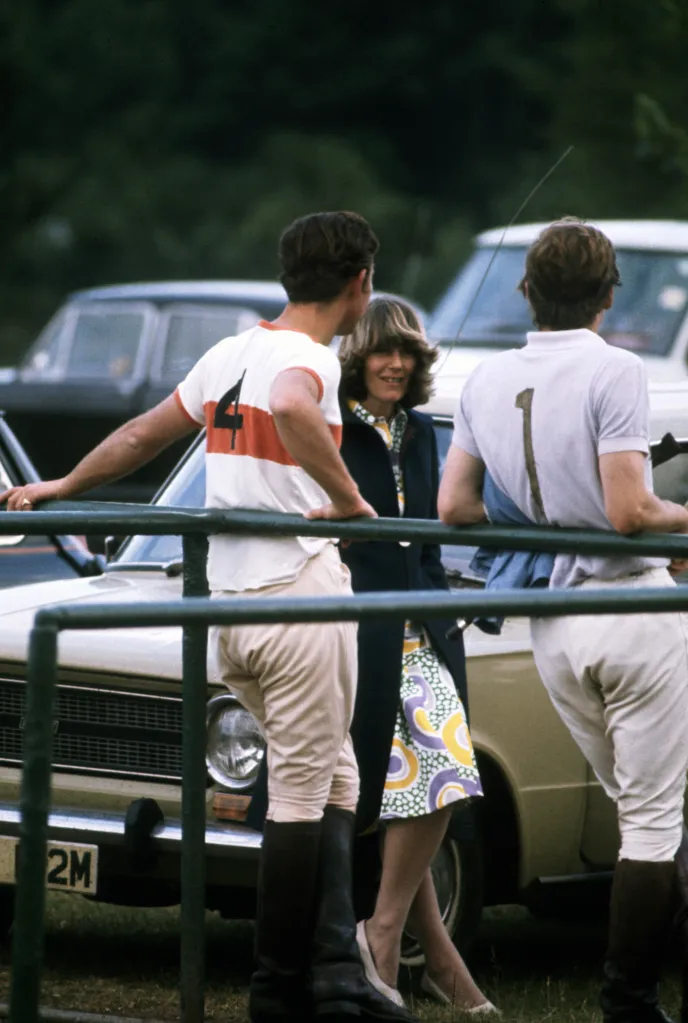 Prince Charles talks with Camilla Parker-Bowles at a polo match in 1972.