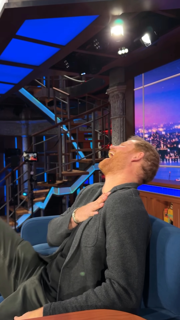 Prince Harry laughing on a talk show set, recreating an Alison Hammond viral moment.