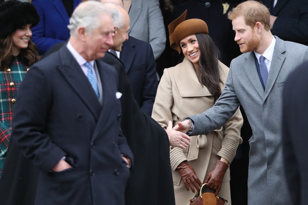 Prince Charles,in a navy blue coat, white shirt and blue tie, Prince Harry,in a grey coat and blue tie and white shirt, Meghan Markle, in a dark brown hat and beige coat and brown bag, and Catherine, Duchess of Cambridge in a black hat and tartan coat, attending Christmas Day Church service.