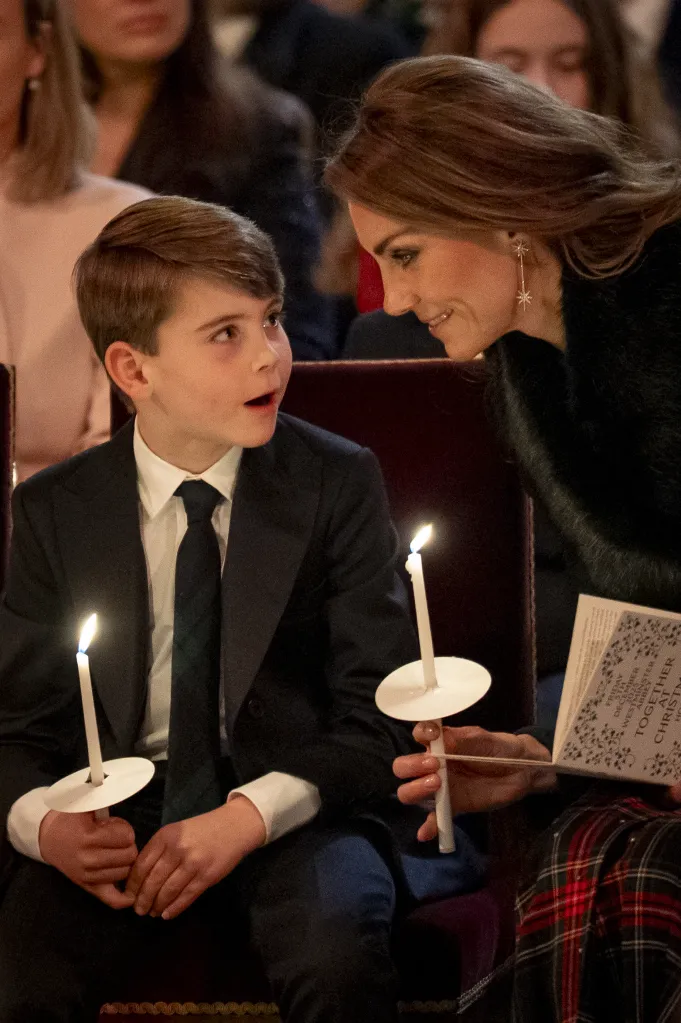 Prince Louis and Kate Middleton holding candles at the Together at Christmas carol service.