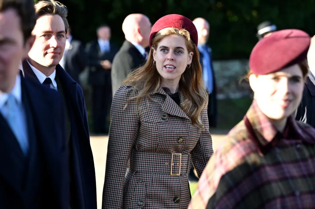 Princess Beatrice of York in a houndstooth coat and a red beret.