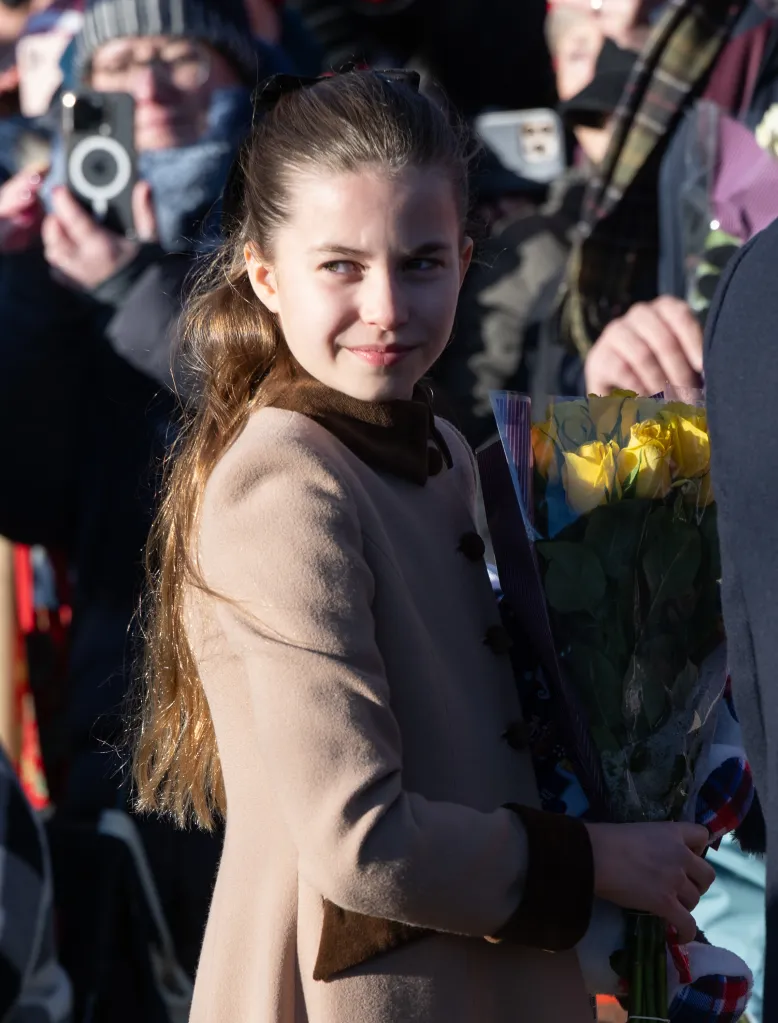 Princess Charlotte holding a bouquet of yellow roses.