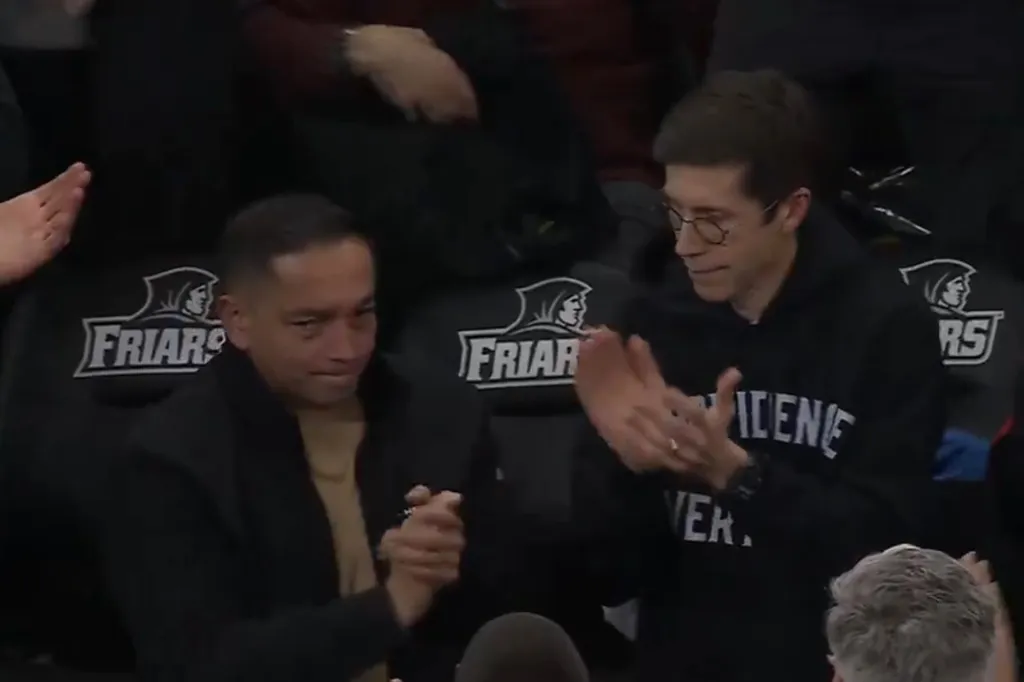 Providence Police Chief Oscar Perez and Providence Mayor Brett Smiley are honored during a college basketball game at Providence College on Dec. 19, 2025.