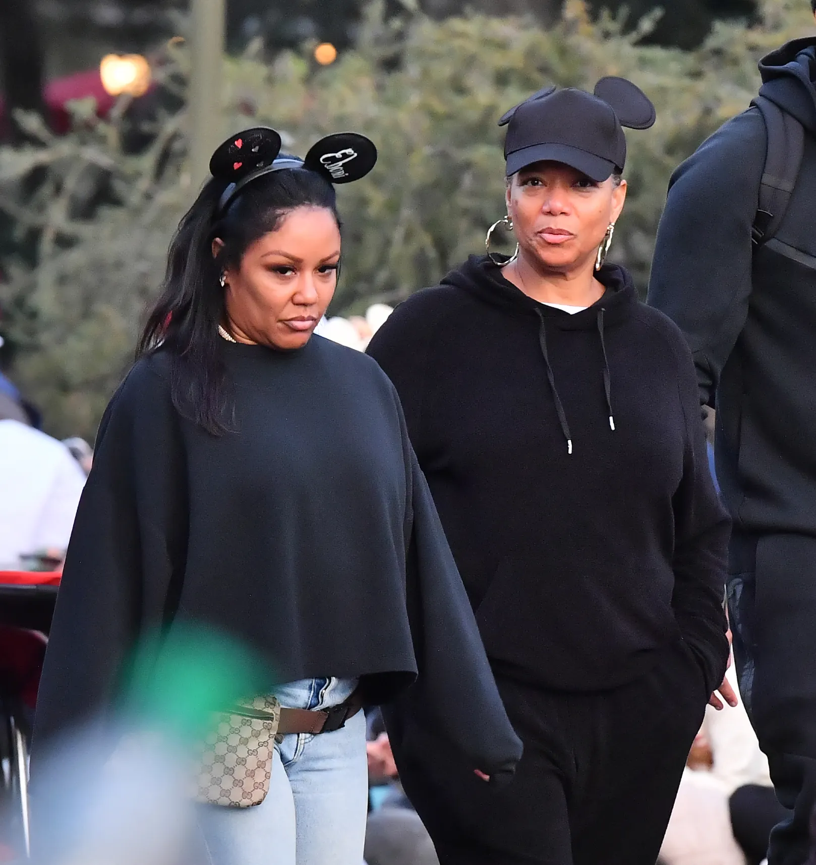 Queen Latifah and Eboni Nichols walking at Disneyland.