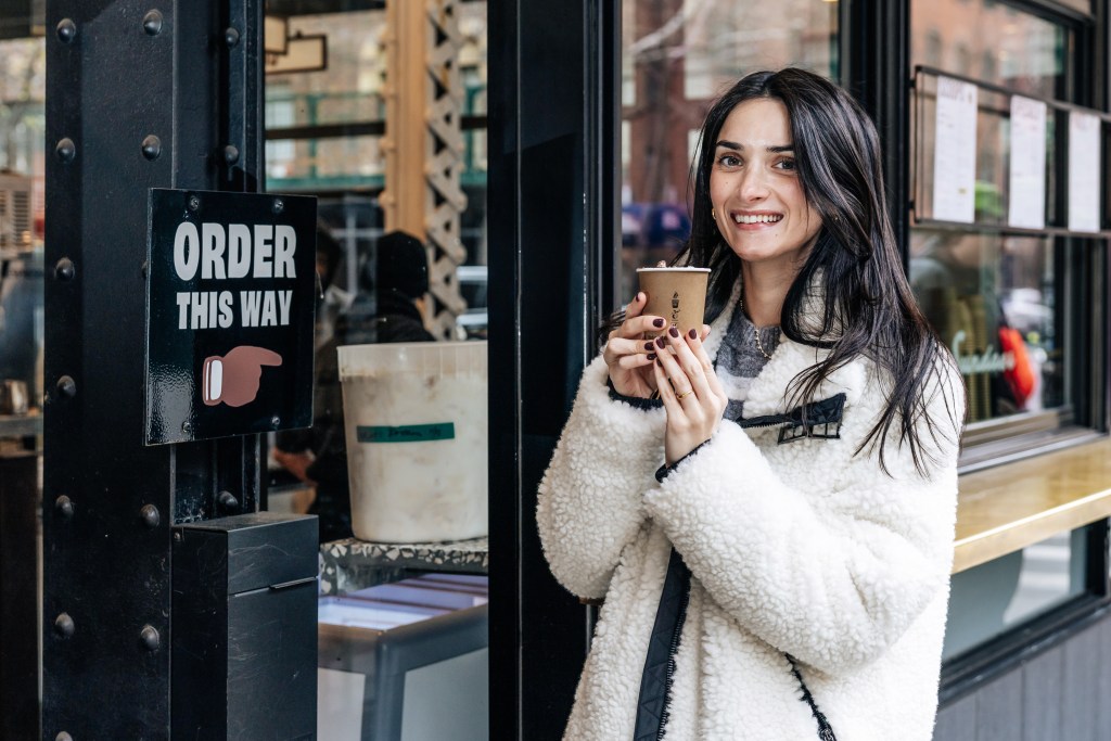 Rachel Brotman of The Carboholic drinking Caffe Panna’s hot chocolate.