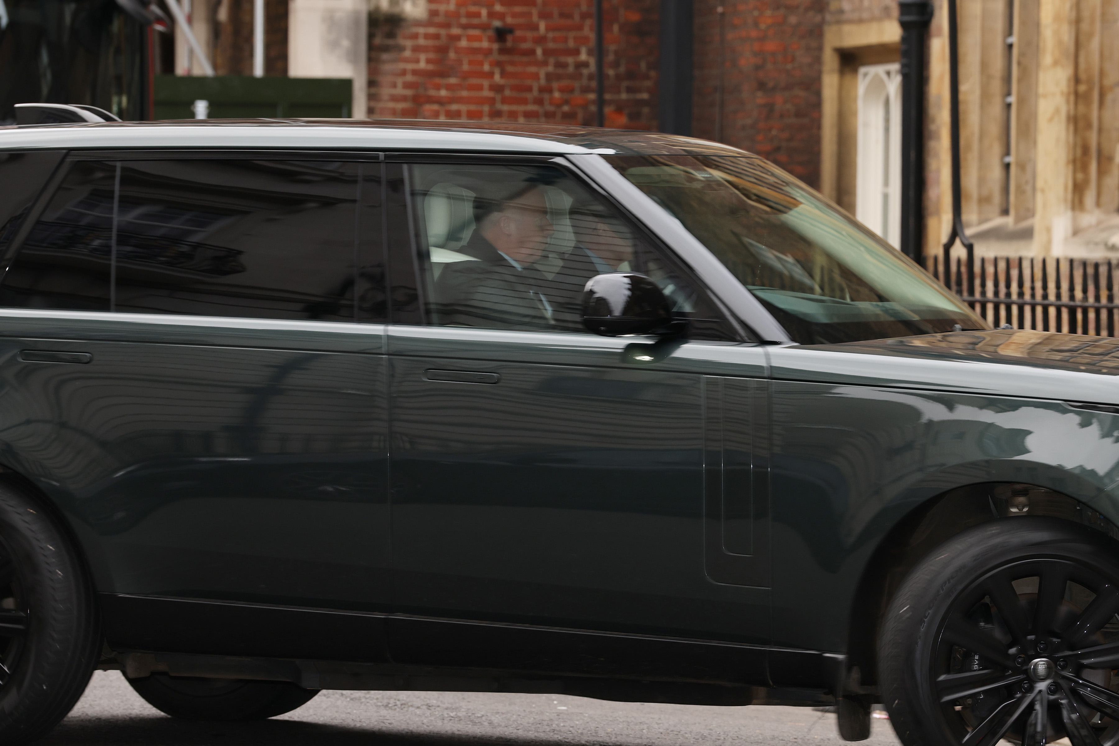 Andrew Mountbatten-Windsor in the back of a Range Rover.