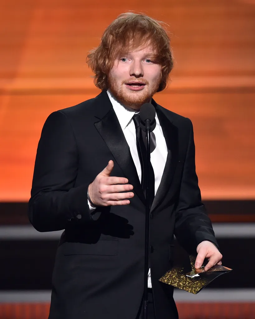 Recording artist Ed Sheeran speaking on stage at the 58th Grammy Awards.