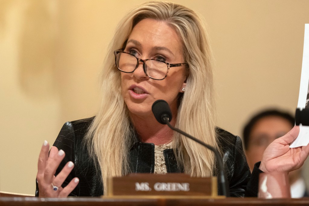 Marjorie Taylor Greene speaking at a hearing.