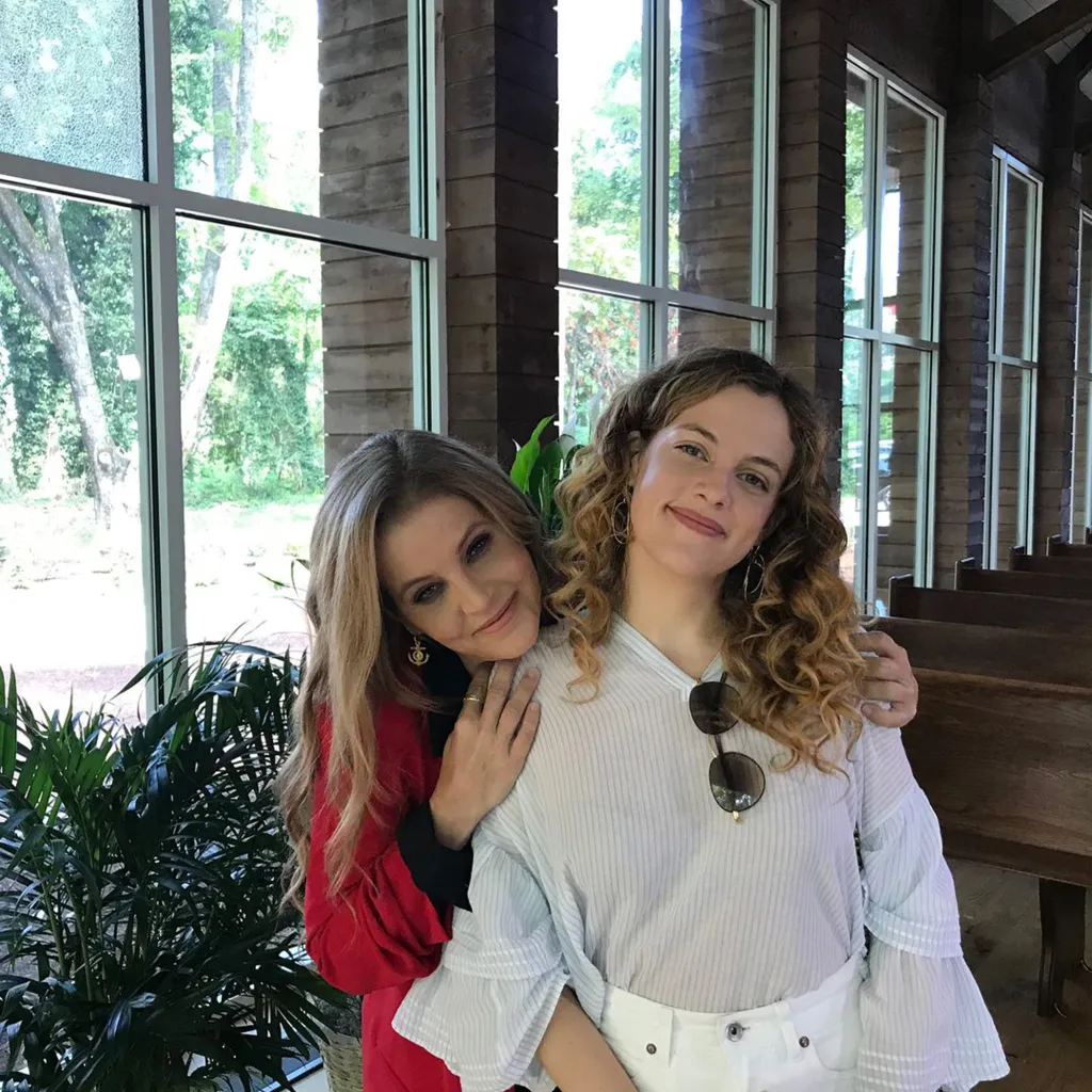 Lisa Marie Presley with her arm around Riley Keough.