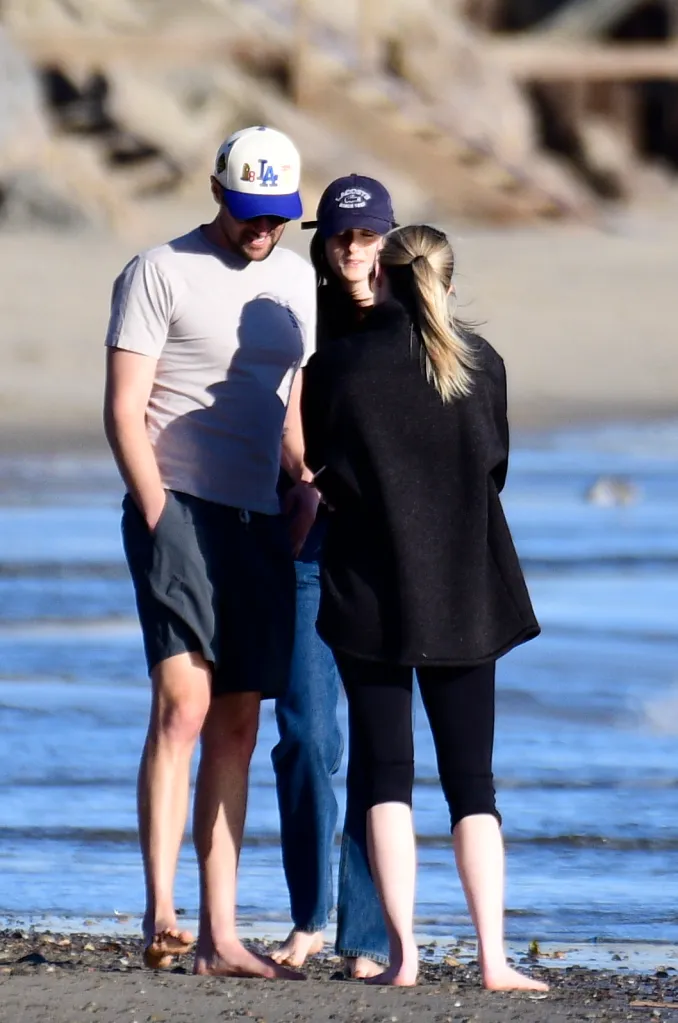 Romy Reiner and Jake Reiner on the beach with Jake's girlfriend and a friend.