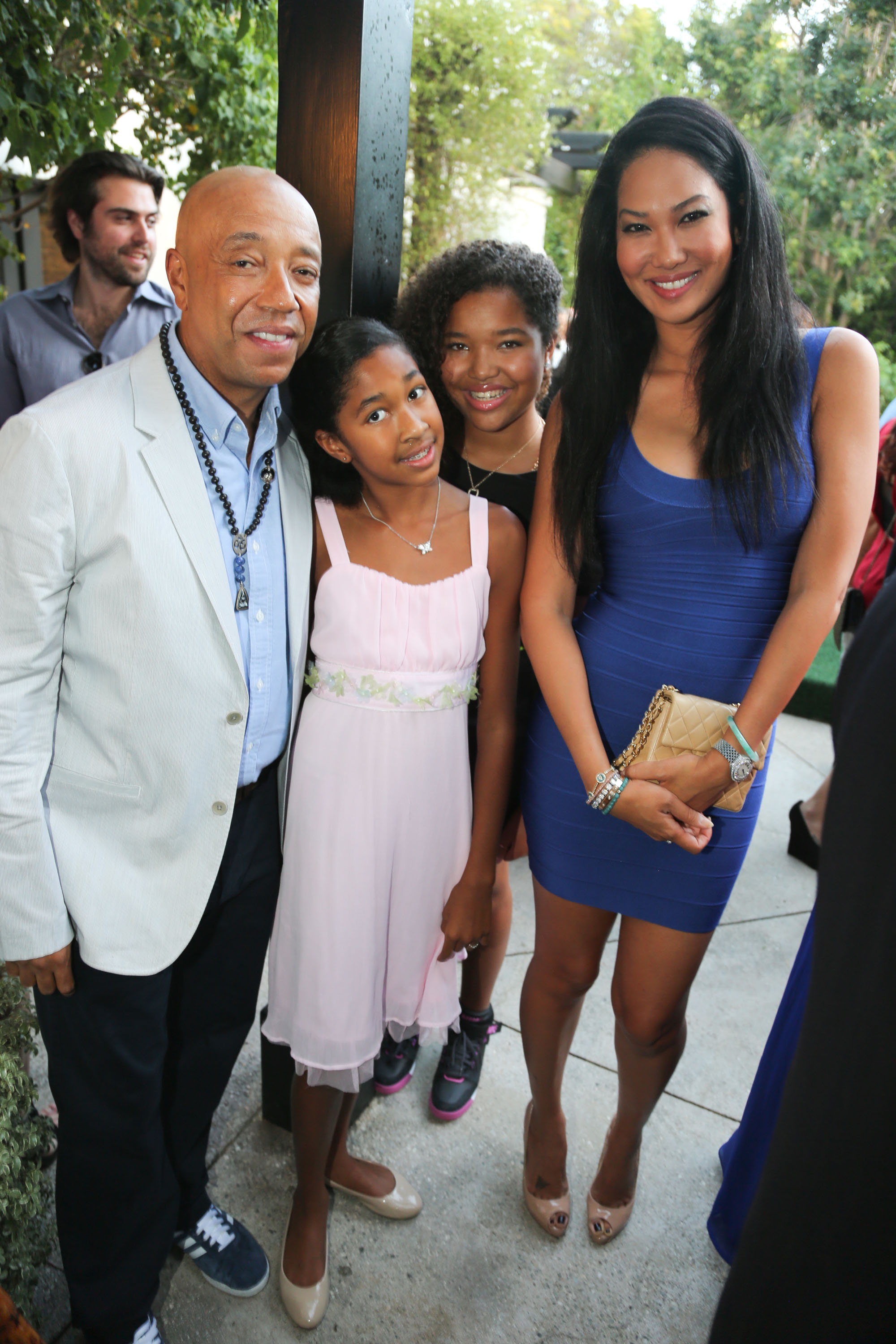 Russell Simmons, Aoki Simmons, Ming Lee Simmons, and Kimora Lee Simmons at a Foundation For Ethnic Understanding Benefit.