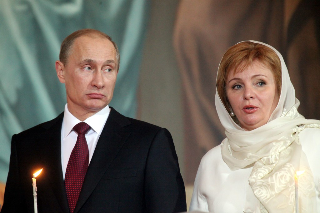 Prime Minister Vladimir Putin and his wife Lyudmila Putina pray during an Orthodox Easter service.