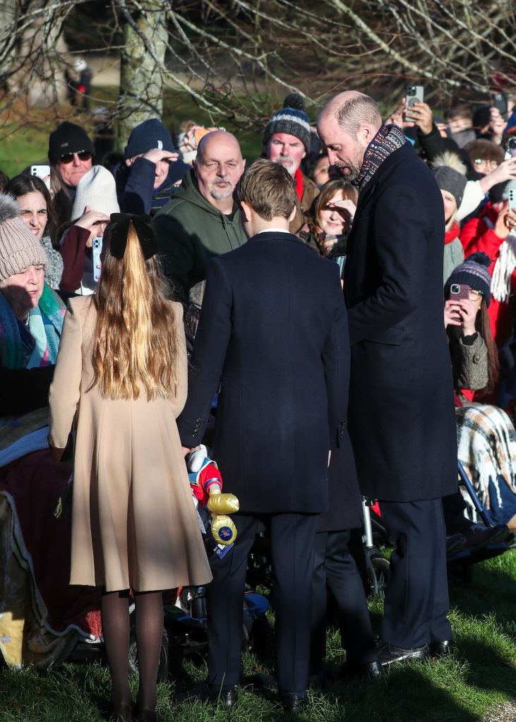 Princess Charlotte, Prince George, and William Prince of Wales greeting crowds at Sandringham on Christmas Day.