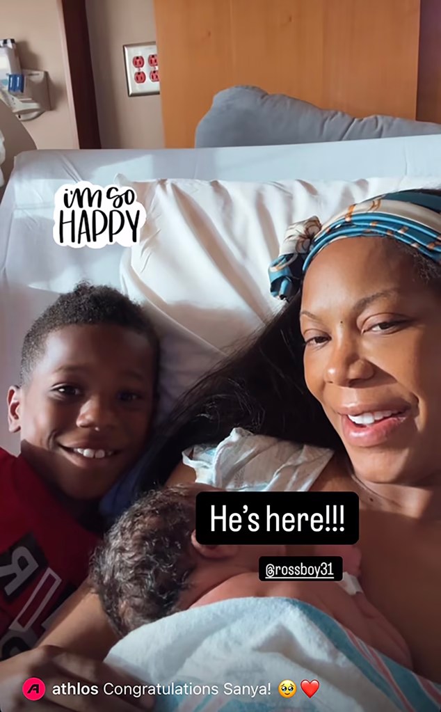 Sanya Richards-Ross with her newborn son and eldest son.