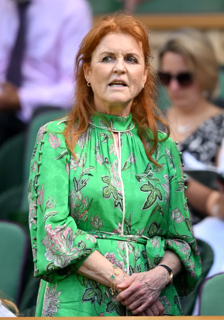 Sarah Ferguson, Duchess of York, in a green dress with pink and black floral patterns.