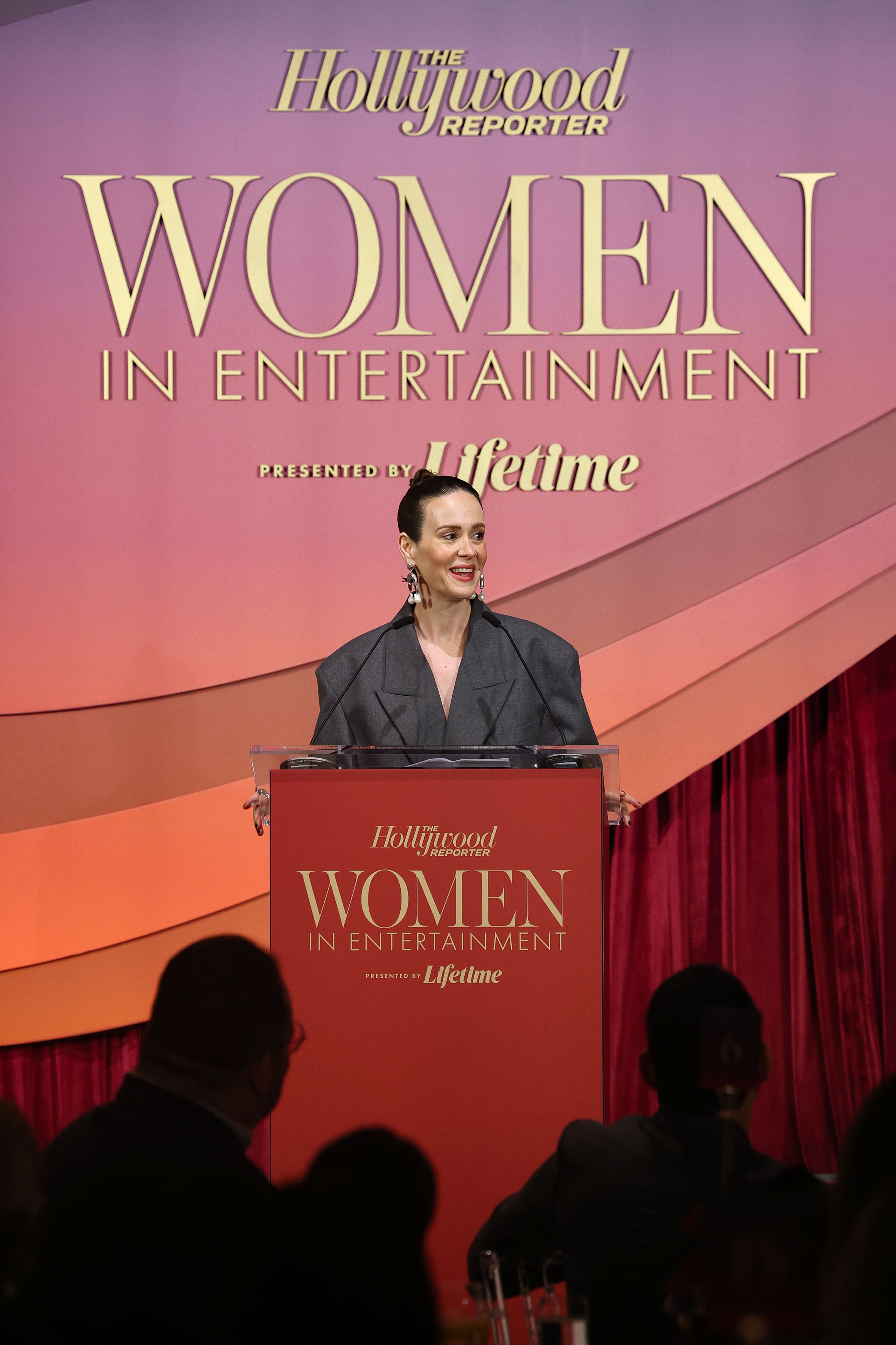 Sarah Paulson speaking onstage at The Hollywood Reporter Women In Entertainment event.