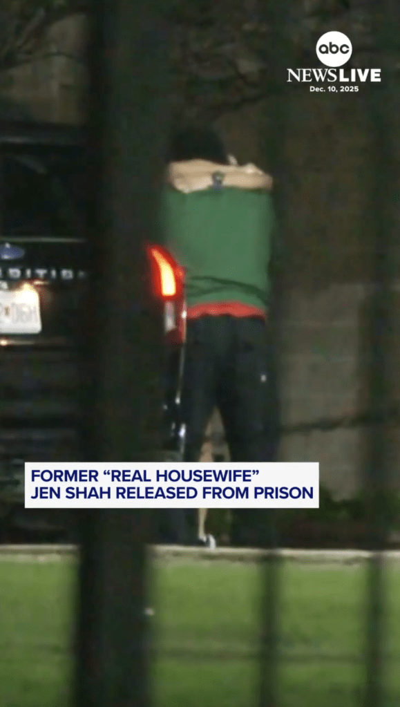 Jen Shah, seen from behind, reunites with her family after prison release.