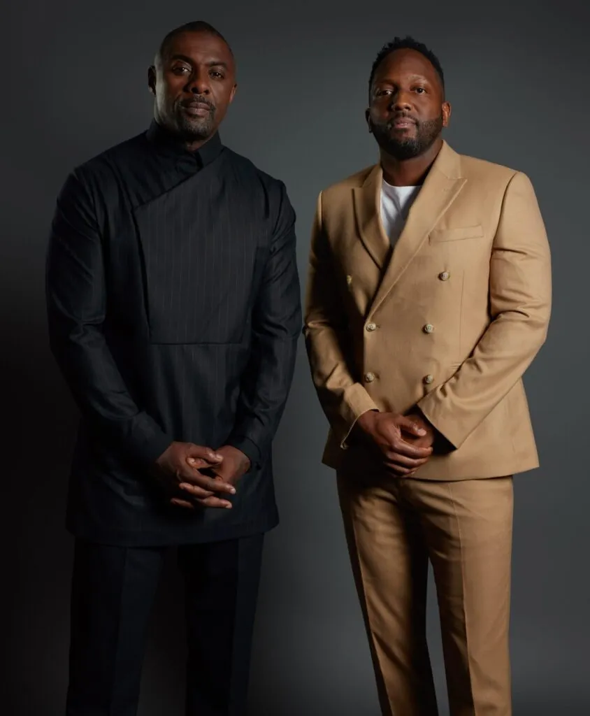 Idris Elba and Siaka Stevens in formal attire.