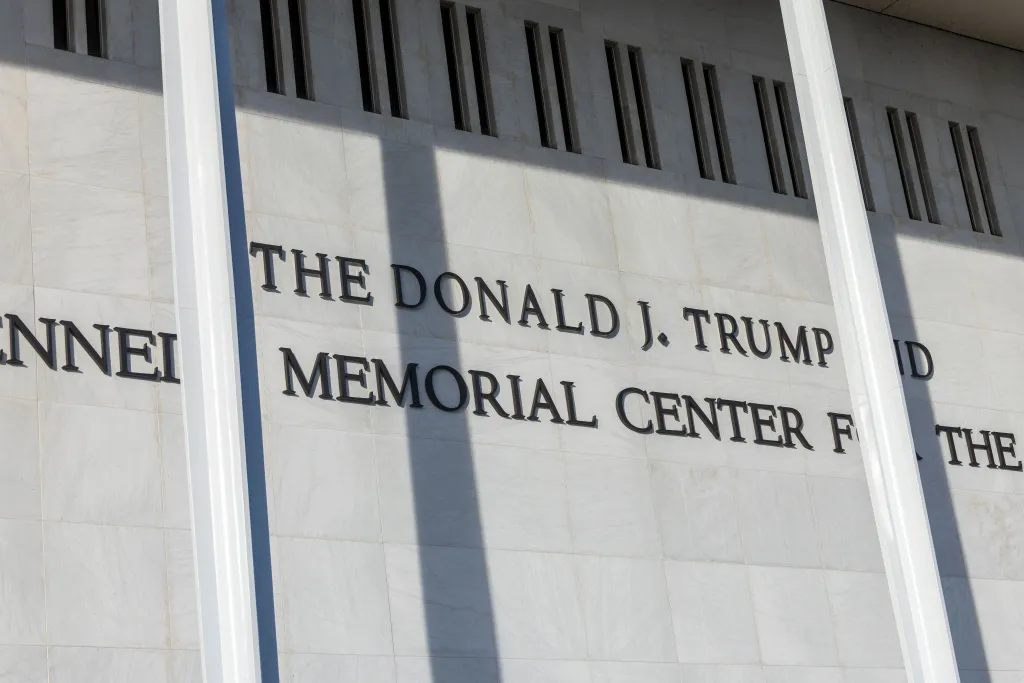 President Donald J. Trump's name is seen above former President John F. Kennedy's on the John F. Kennedy Memorial Center for the Performing Arts building, in Washington, DC, USA, 20 December 2025. 