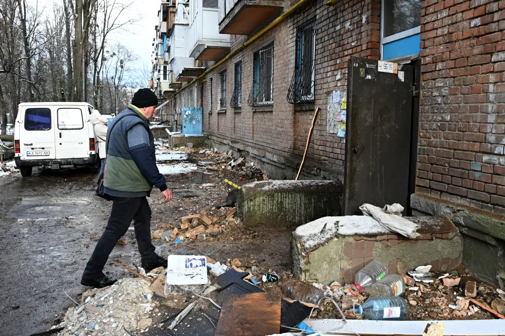 A man enters a damaged house after a drone strike in the Shevchenkivskyi district of Kyiv, Ukraine, December 28, 2025.
