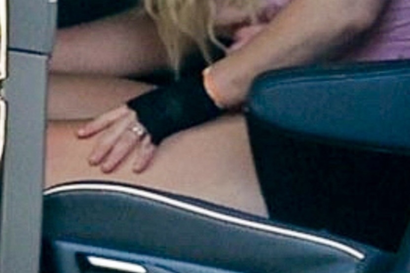 Britney Spears' hand with a ring on her finger.