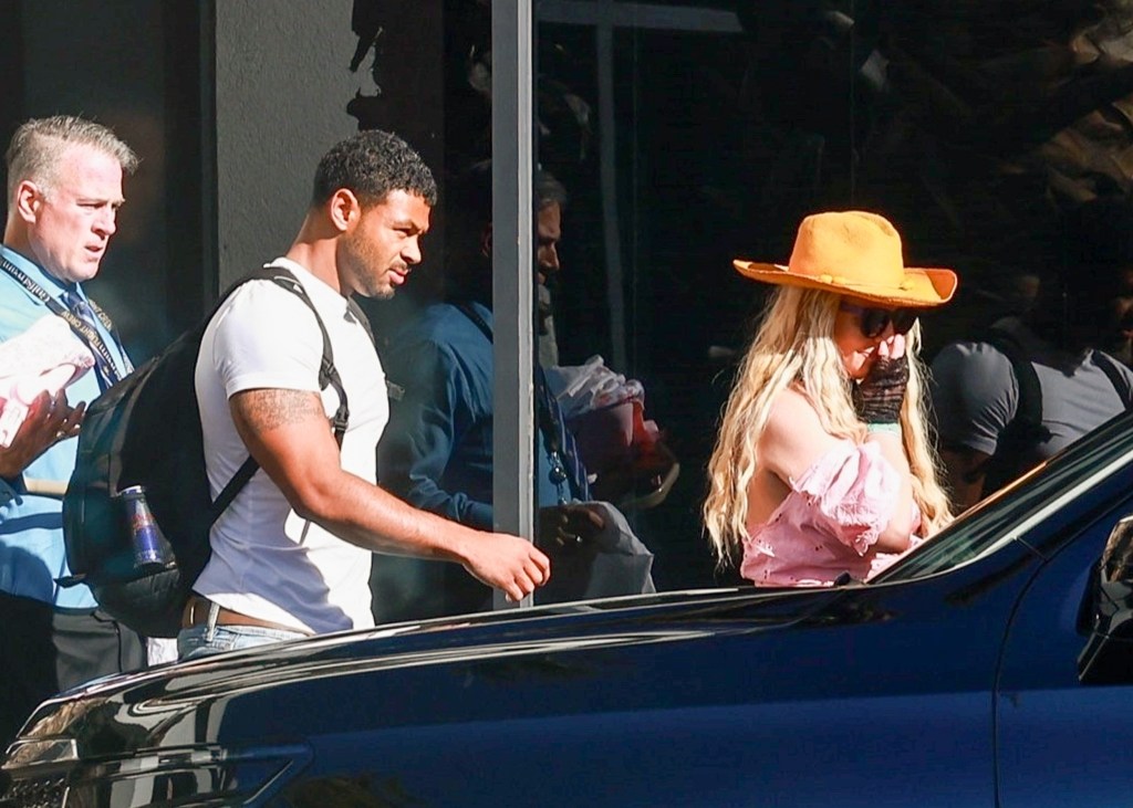 Britney Spears arriving in Los Angeles with a mystery man.