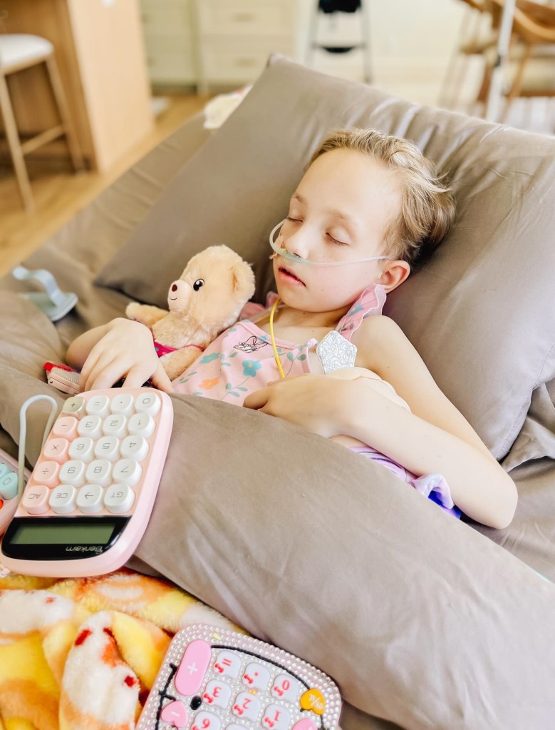 Brie Bird is seen sleeping in bed.