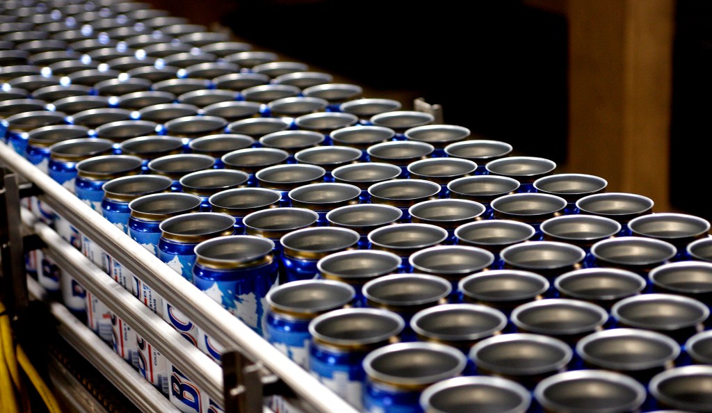 Empty Busch beer cans moving on a conveyor belt at the Anheuser-Busch InBev brewery.