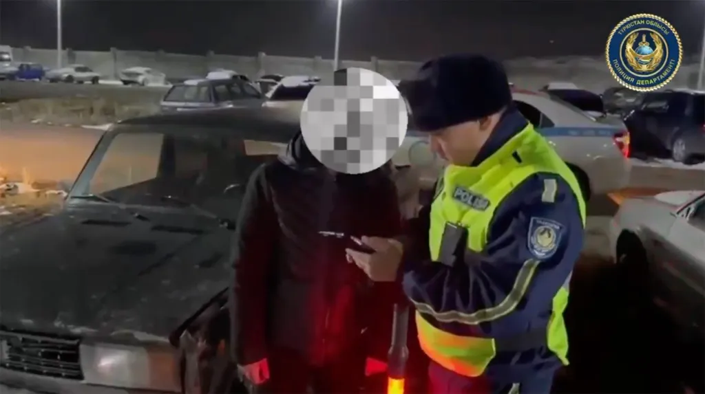A Lada driver being questioned by police after knocking over a Christmas tree in Kazakhstan.