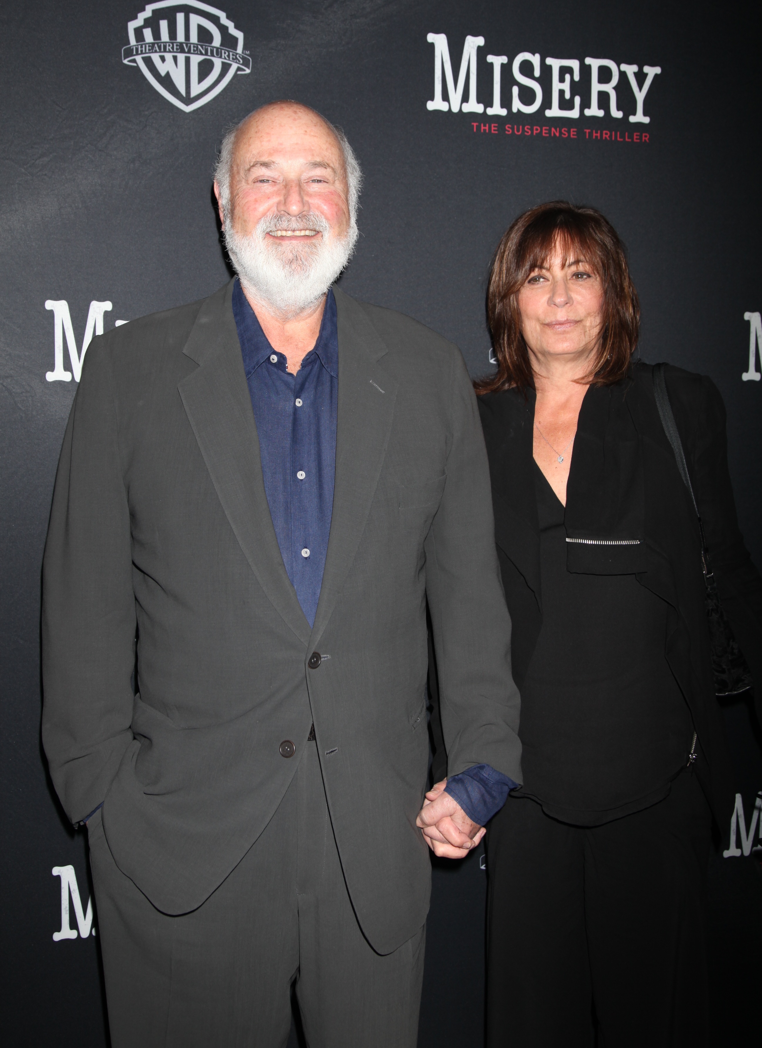Rob Reiner and Michele Singer Reiner smiling and holding hands at the Misery Broadway Opening Night.
