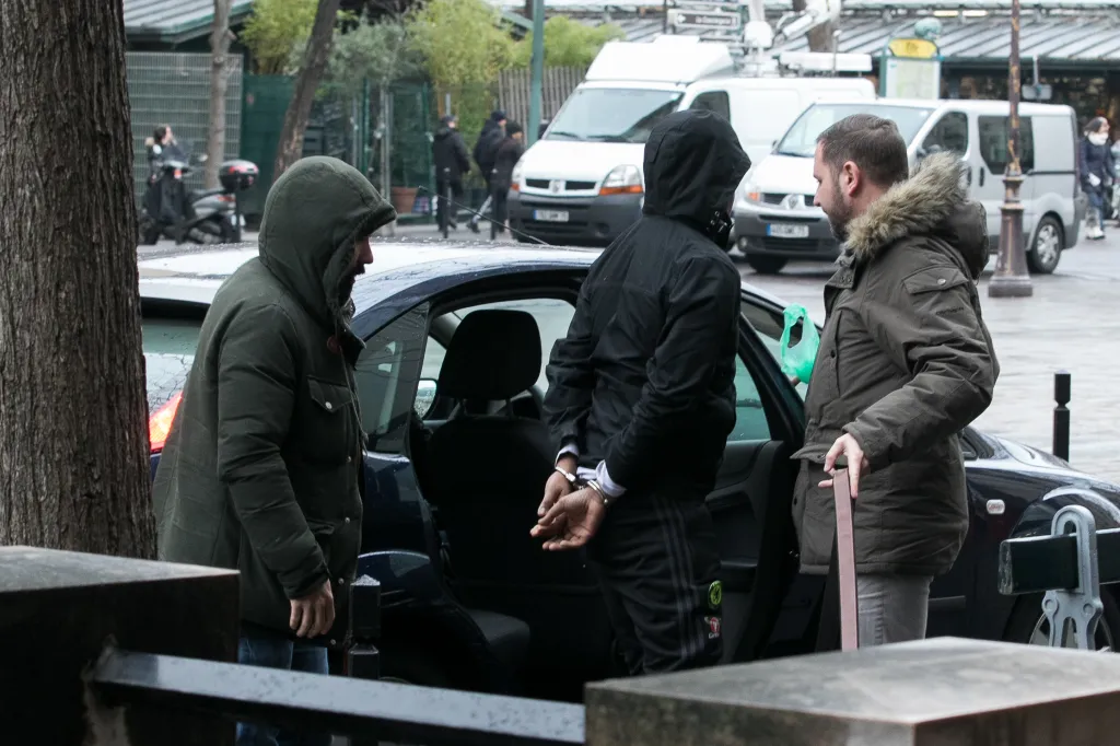 A suspect in Kim Kardashian's Paris robbery in handcuffs