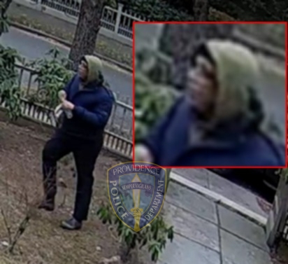 Security camera footage of a person walking, with an inset close-up of their face.