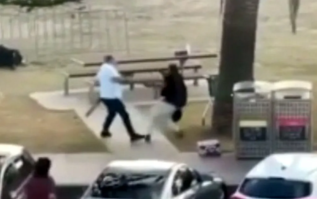 A low-quality video frame shows a citizen hero disarming an attacker during the Bondi Beach shooting.