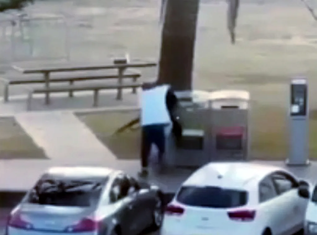 Ahmed is seen running up to one of the shooters during the mass shooting at Bondi Beach. disarmed a terrorist shooter on Bondi Beach in Sydney, Sunday, Dec. 14, 2025.