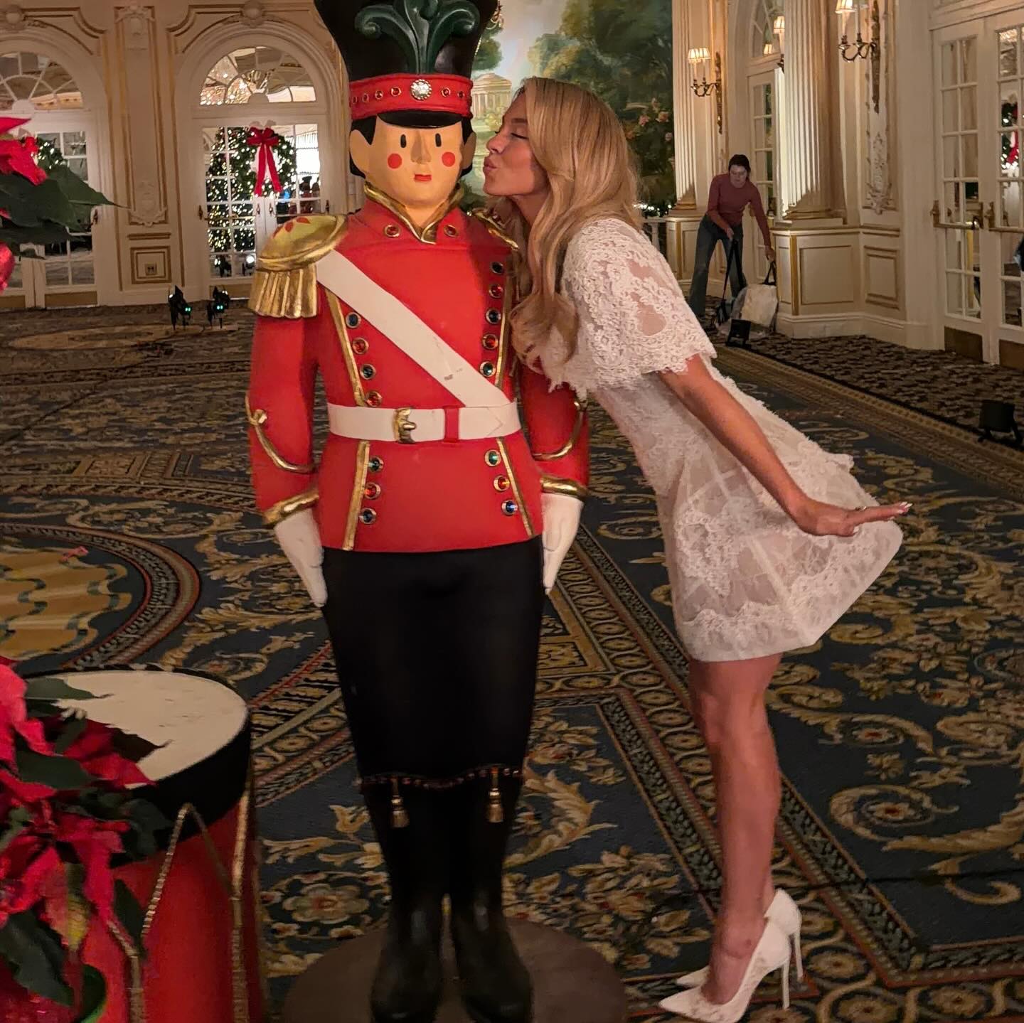 Sydney Sweeney poses with a toy soldier during a promotional tour for 