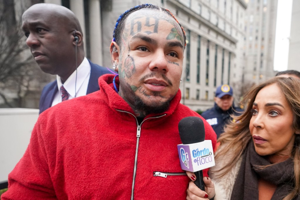 Takashi 6ix9ine, in a red jacket, leaving the 60 Foley Square Courthouse.