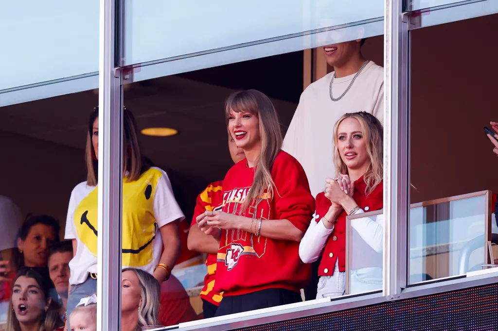 Taylor Swift and Brittany Mahomes watching a Chiefs football game.