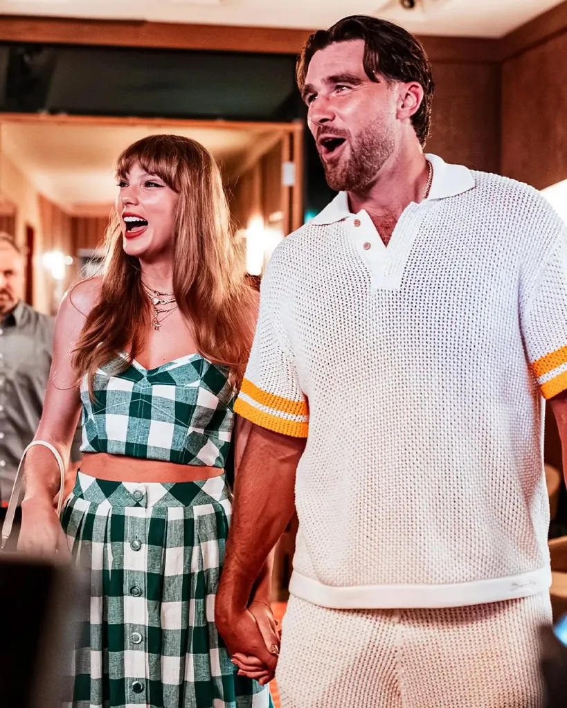 Taylor Swift and Travis Kelce holding hands and laughing.