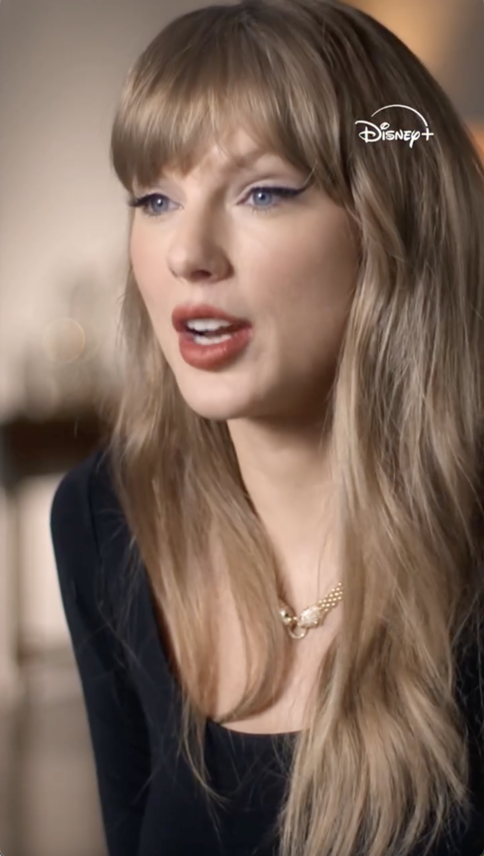 Taylor Swift with a Disney+ logo in the top right corner.